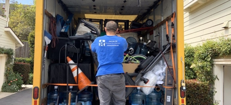 Mover securing items in a moving truck