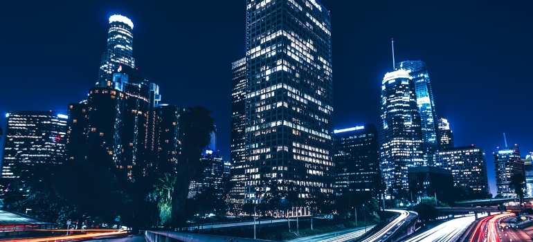 The photo of LA by night can make you think of moving from San Diego to Dallas–Fort Worth metroplex.